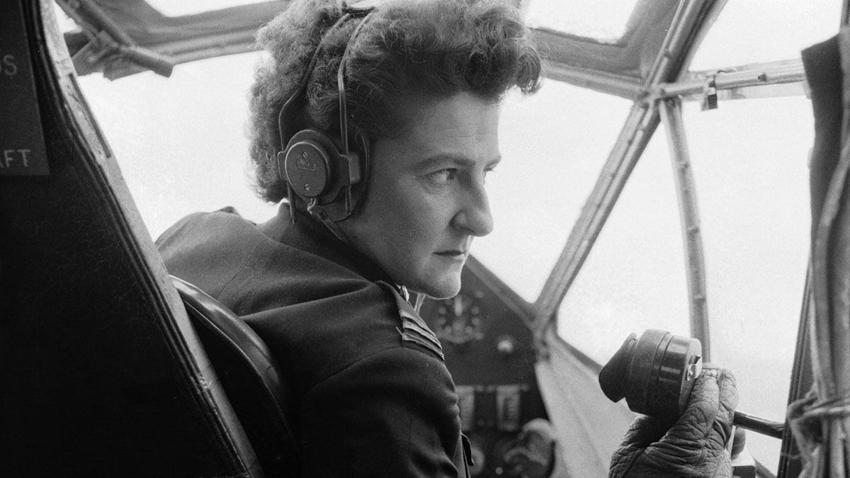 Pilot Monique Rendall in the cockpit of an aircraft in 1955