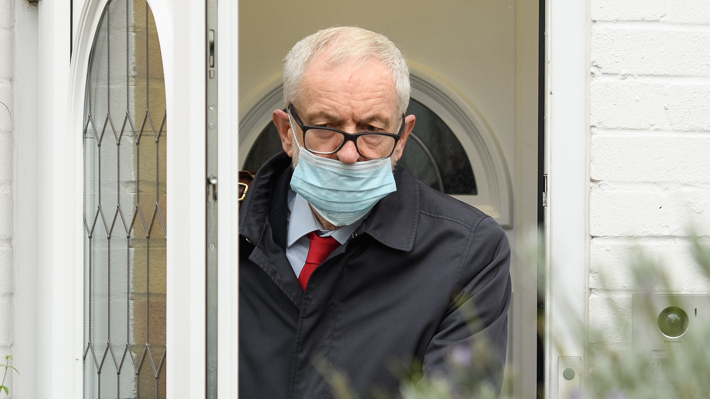 Former Labour Party leader Jeremy Corbyn leaves his home.
