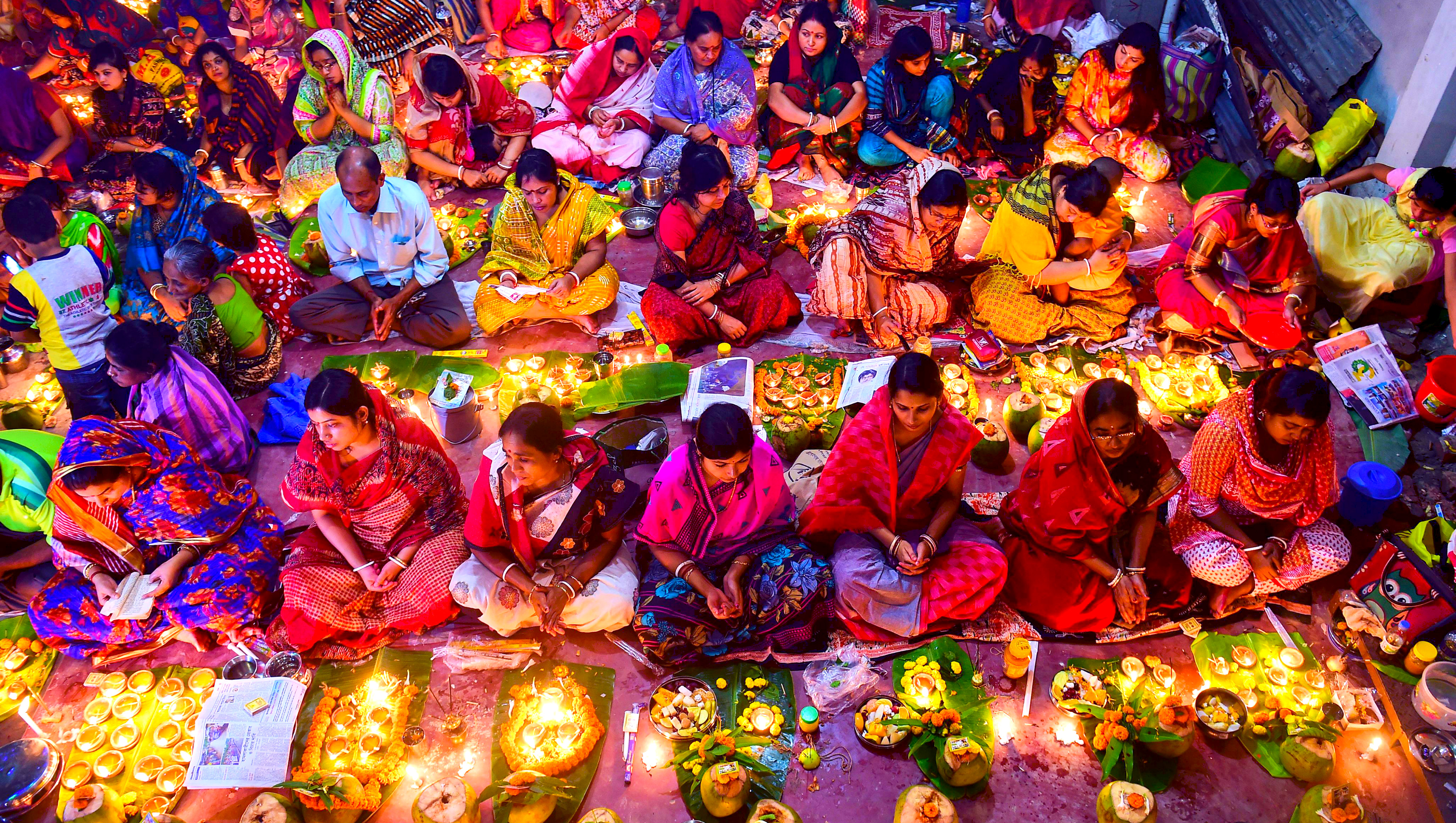 Hindu devotees in Dhaka offer prayers as they prepare to break their fast during the Rakher Updbas festival