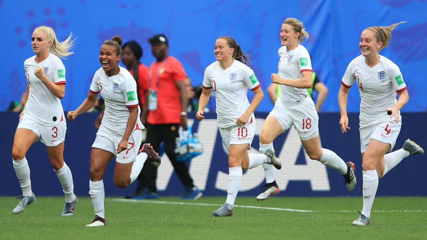 England players celebrate a goal against Cameroon in the World Cup round of 16 