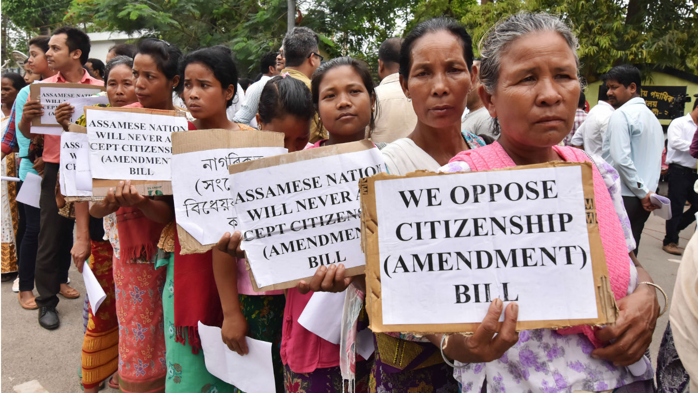 Anti-Bengali Indian demonstrators hold placards during a protest against the Citizenship (Amendment) Bill in 2016