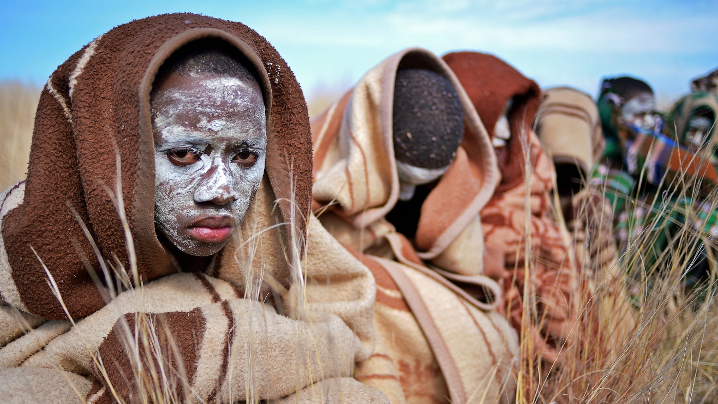 Boys from the Xhosa tribe who have undergone a circumcision ceremony sit near Qunu on June 30, 2013. 