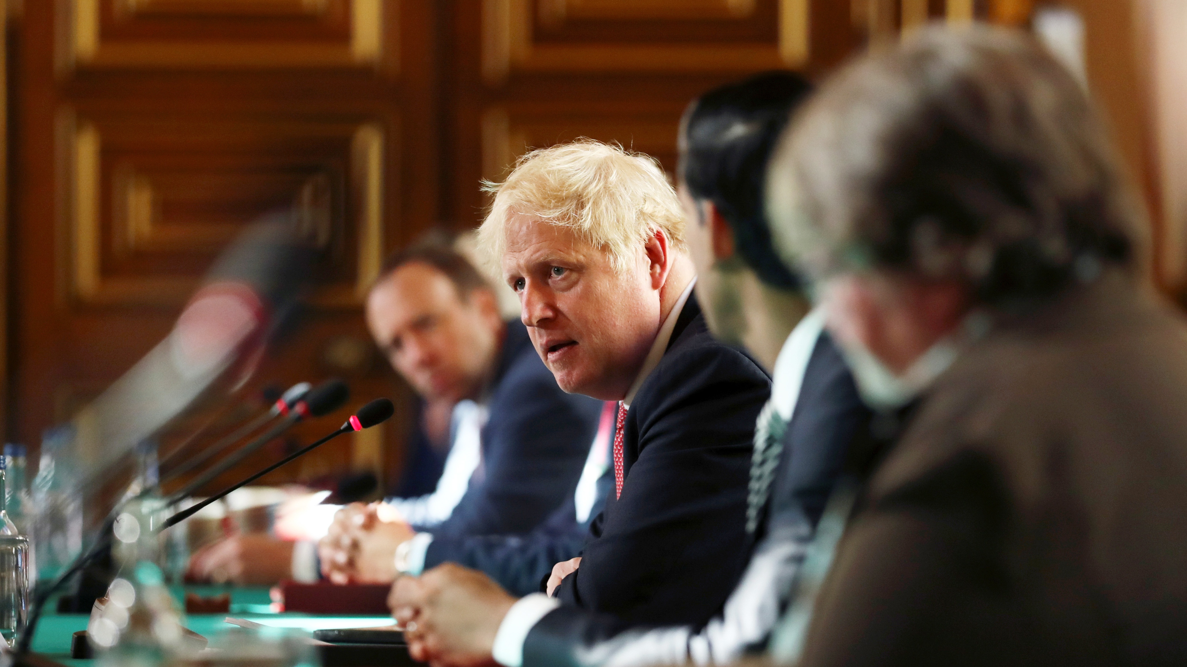 Boris Johnson chairs a socially distanced meeting of the cabinet.