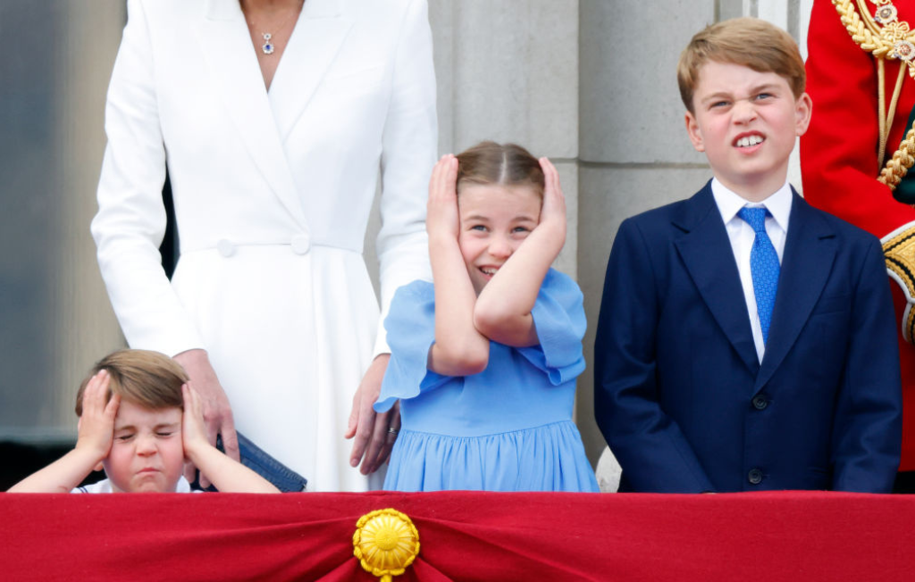 Princess Charlotte with brothers George and Louis pull faces on Buckingham Palace balcony