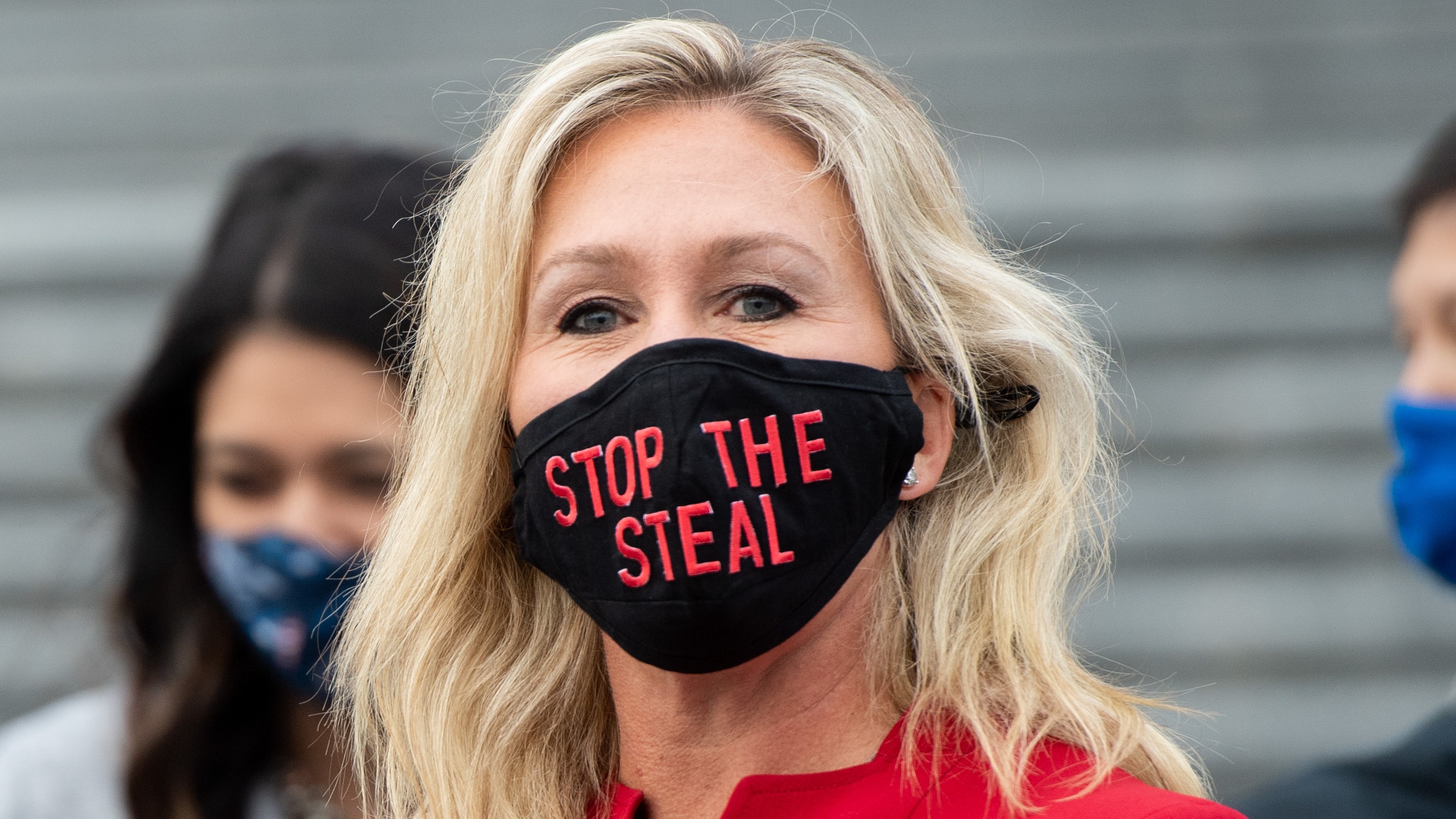 Marjorie Taylor Greene wearing a ‘stop the steal’ face mask, a slogan associated with baseless allegations of election fraud