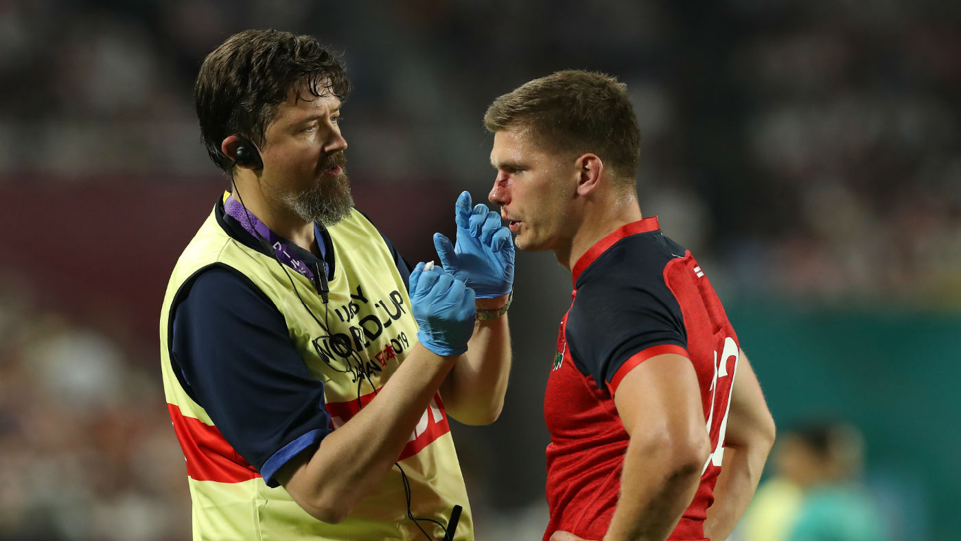 England’s Owen Farrell receives treatment during the Rugby World Cup clash against the USA
