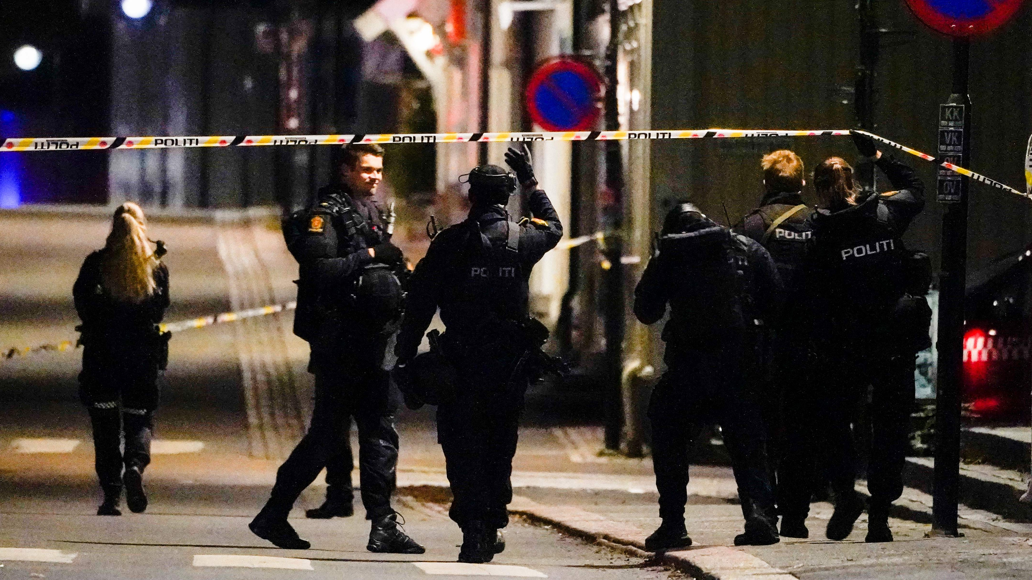 Police officers cordon off a crime scene in Kongsberg, Norway