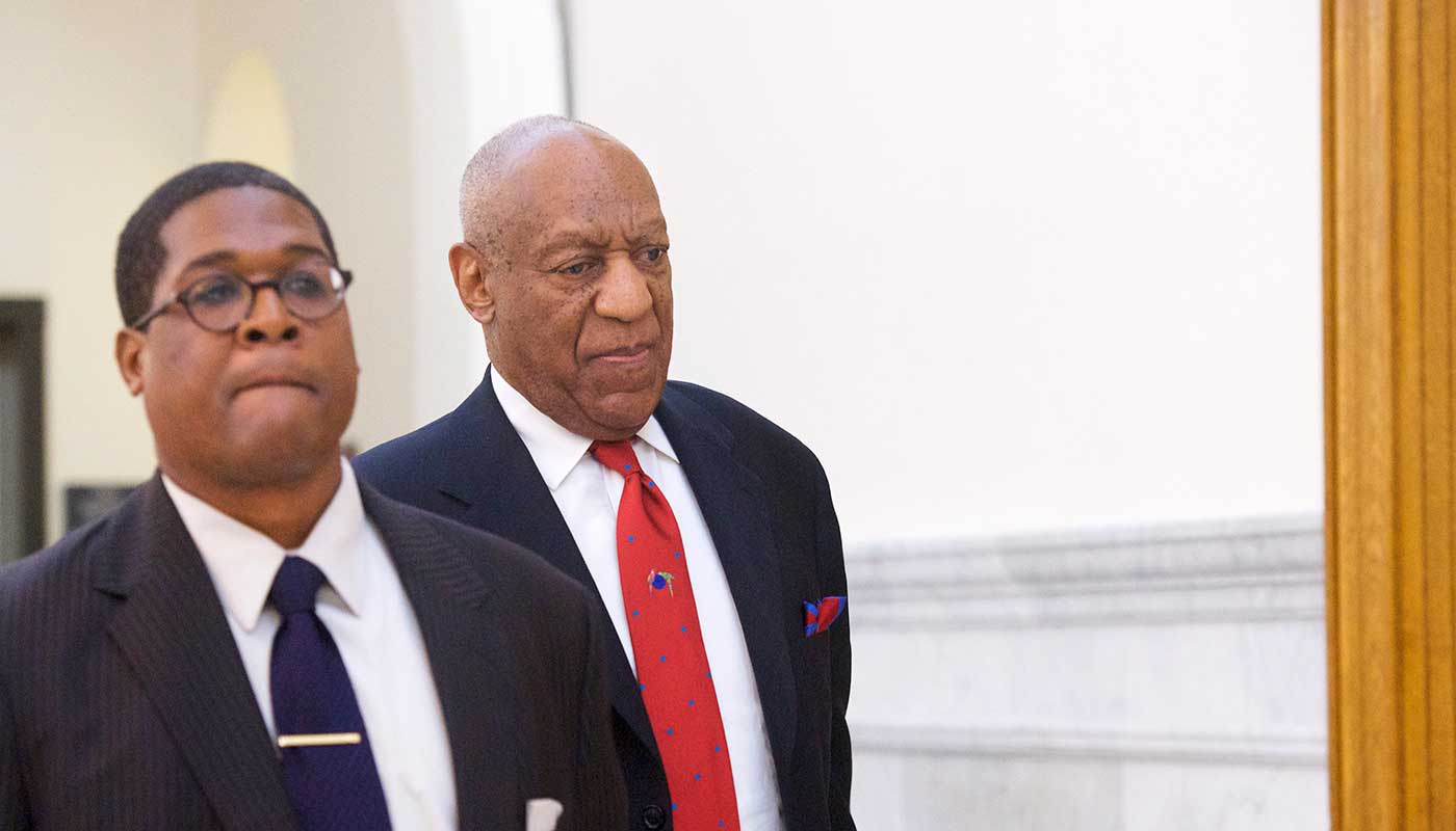 Bill Cosby leaves court after being found guilty on all counts of aggravated indecent assault