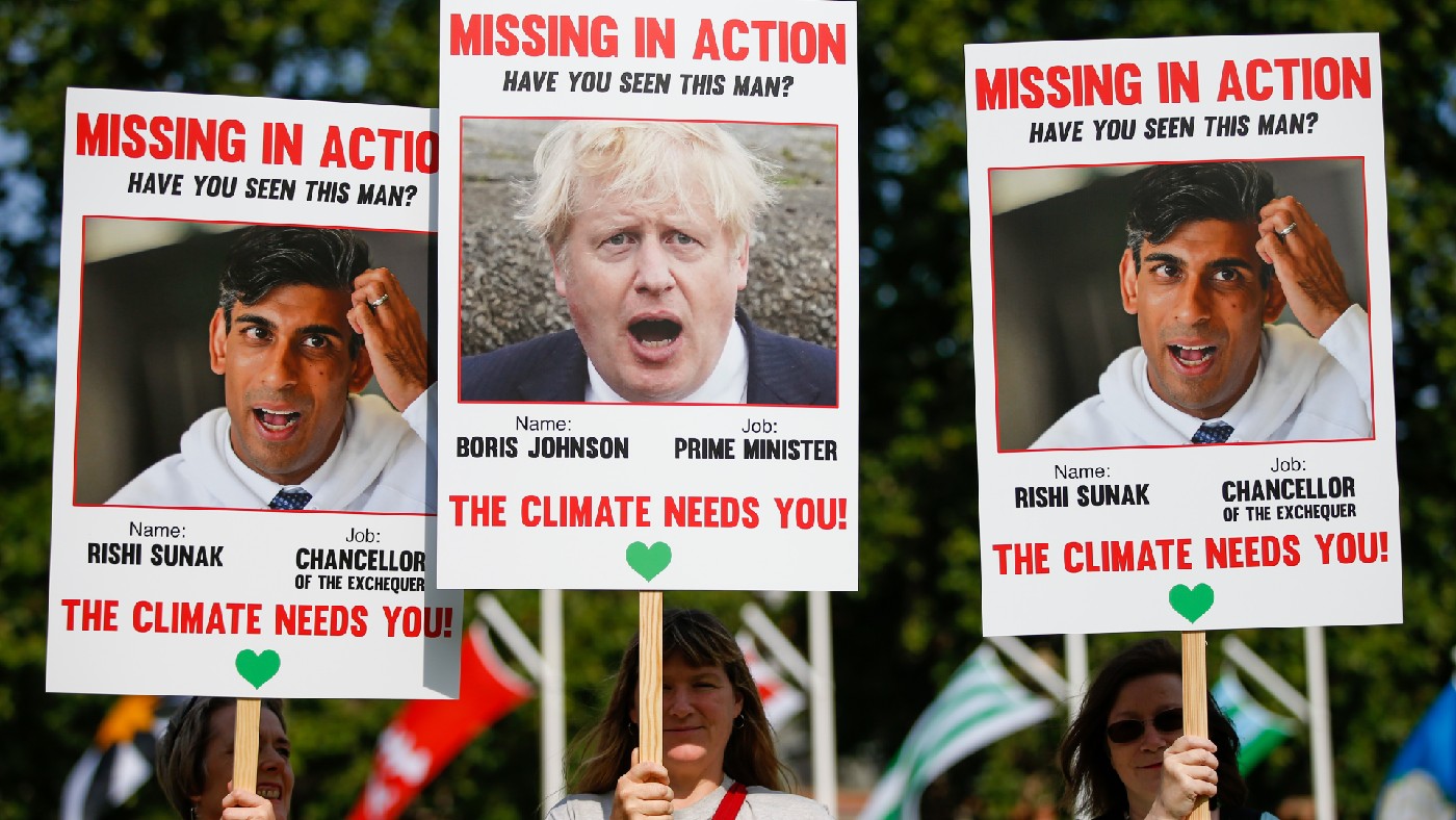 Protesters hold &#039;Missing in Action&#039; style placards of Prime Minister Boris Johnson and Chancellor Rishi Sunak with the phrase &#039;The climate needs you!&#039; 