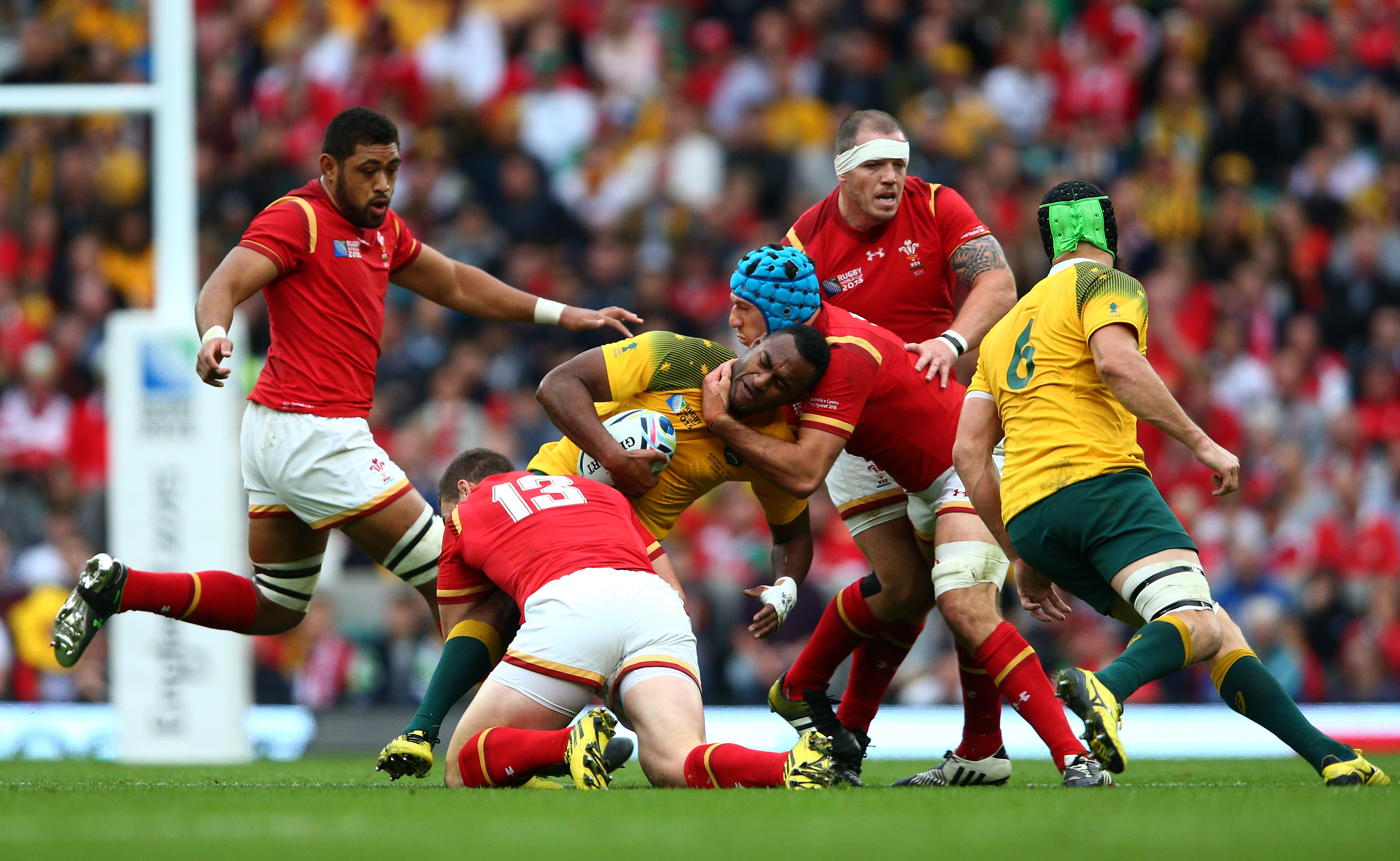 LONDON, ENGLAND - OCTOBER 10:Tevita Kuridrani of Australia is tackled by George North and Justin Tipuric of Wales during the 2015 Rugby World Cup Pool A match between Australia and Wales at T