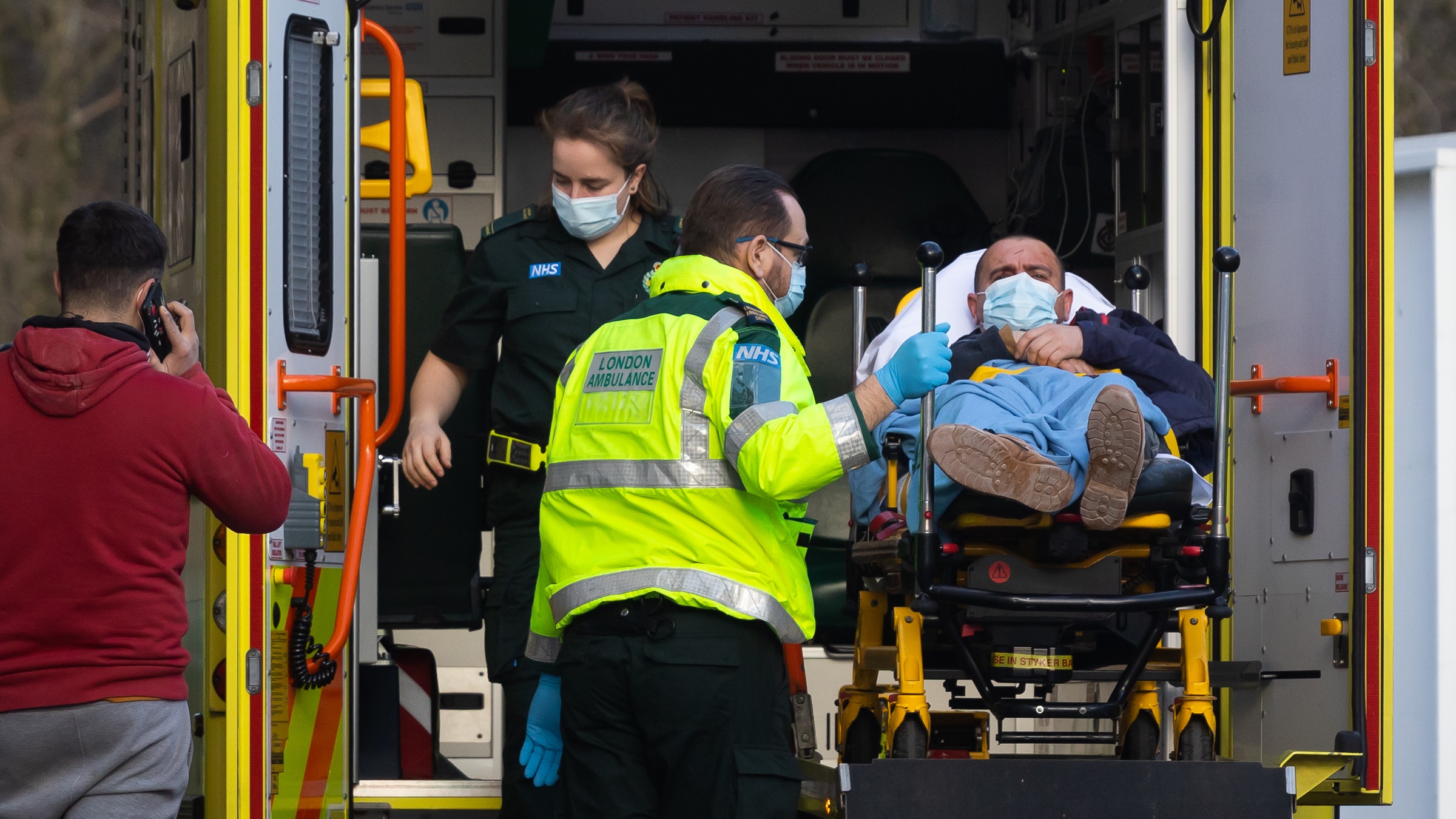 Ambulance staff unload a patient at St Thomas&#039; Hospital, London
