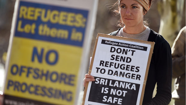 A woman protests Australian immigration policy 