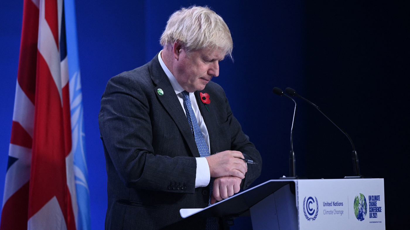 Boris Johnson looking at his watch
