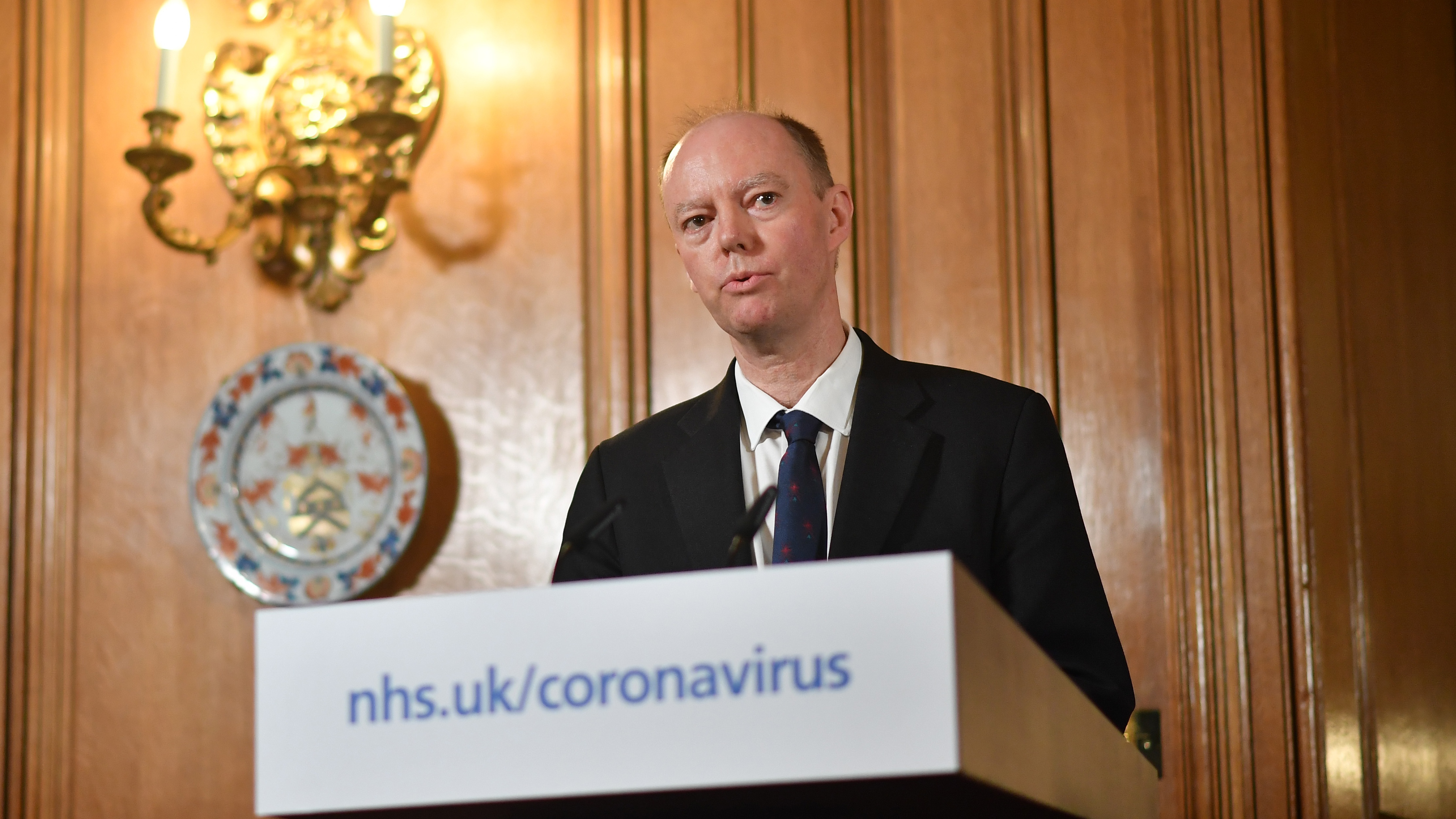 Chief Medical Officer Chris Whitty speaks during a press conference with Boris Johnson