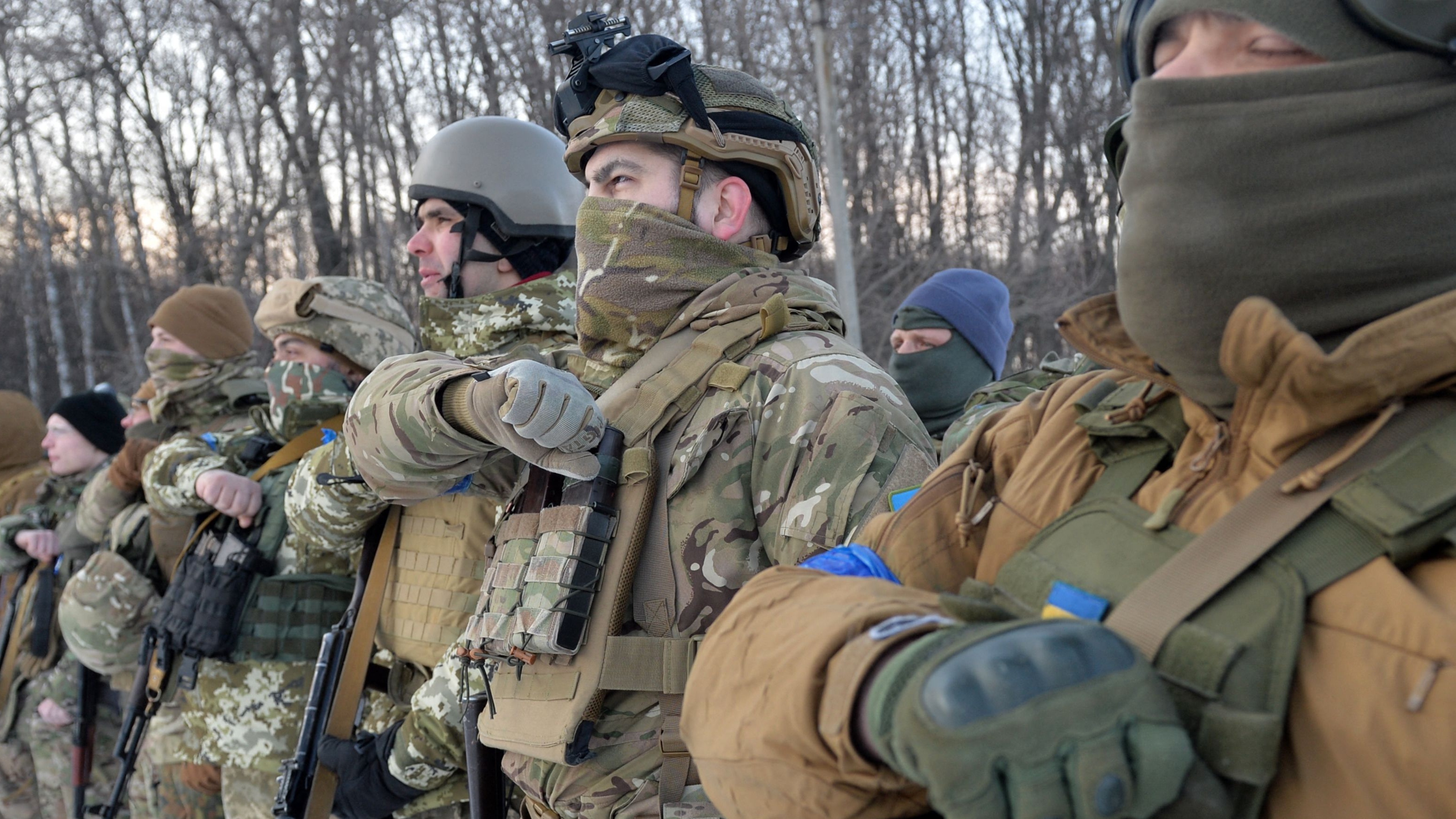 Members of the Azov Battalion pray near the city of Kharkiv