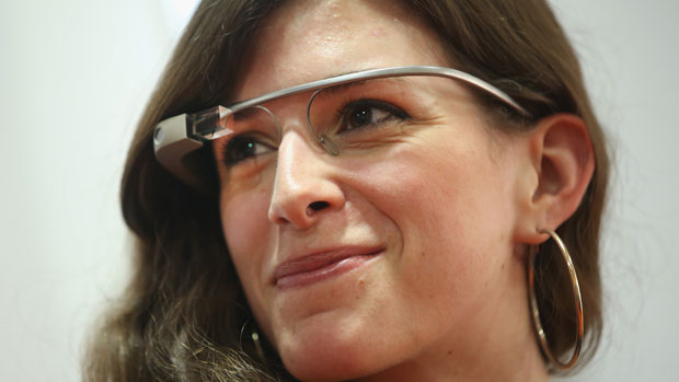 A woman wears Google Glass