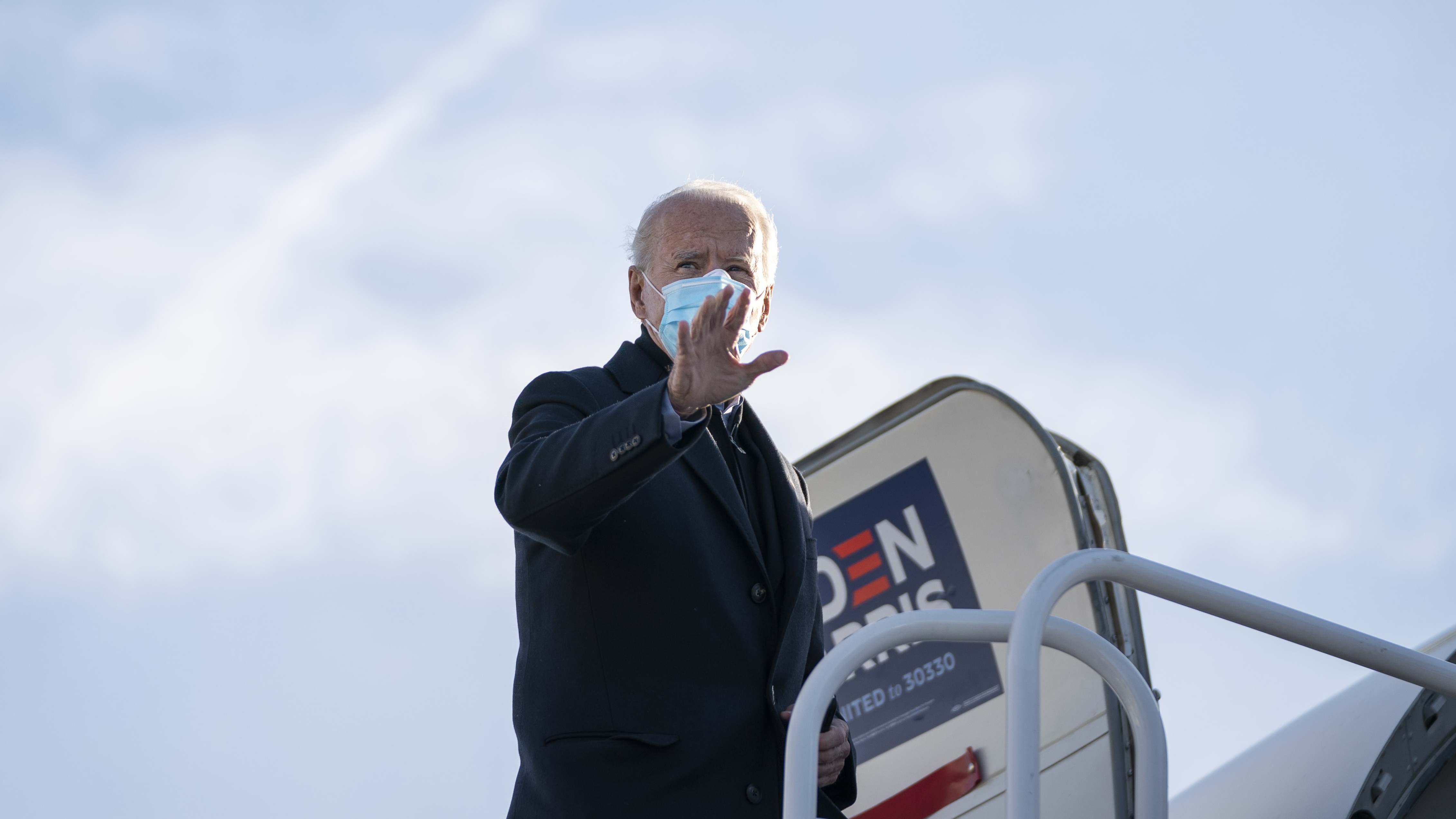 Democratic presidential nominee Joe Biden boards his campaign plane.