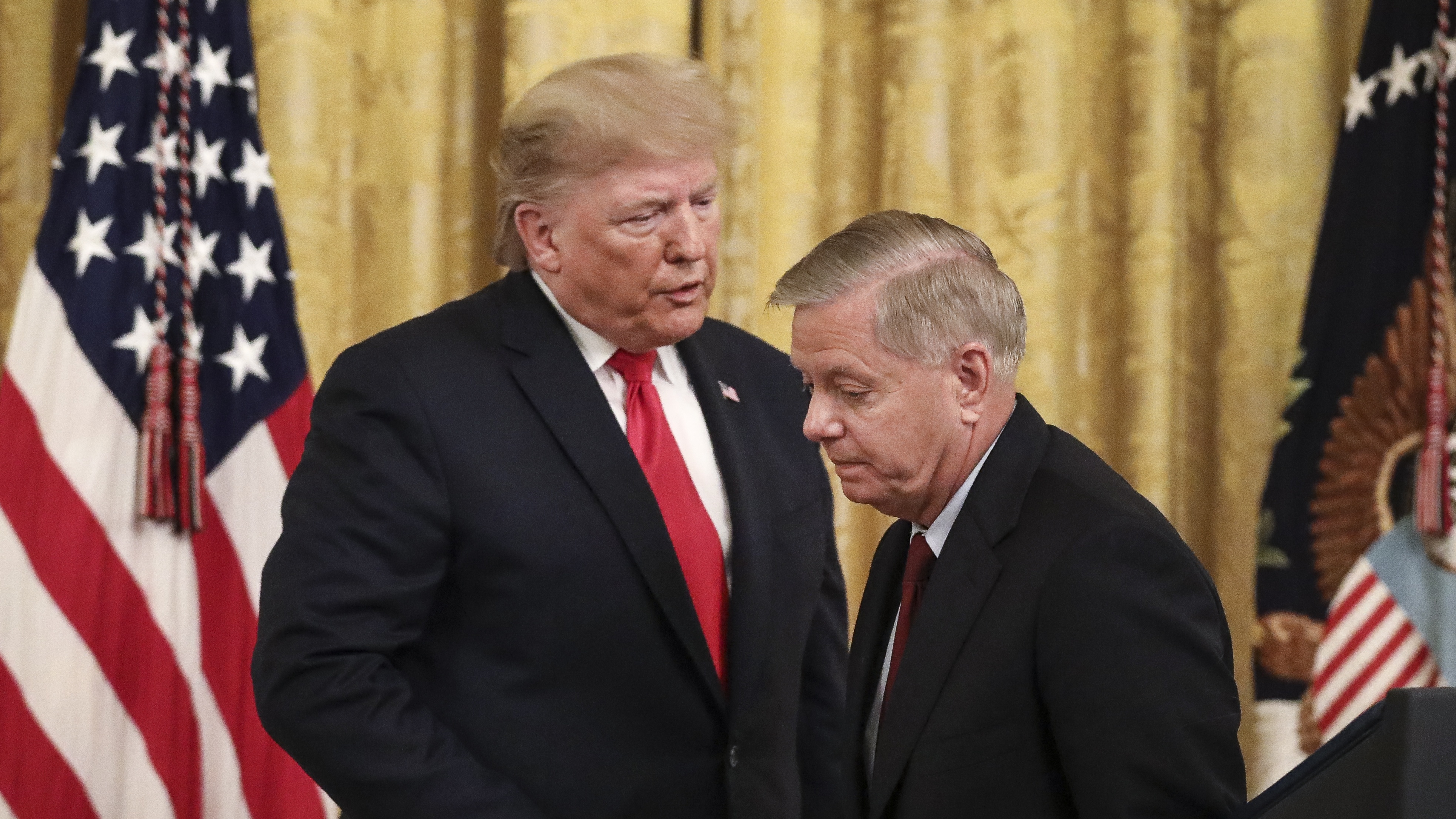 Donald Trump with Lindsey Graham during an event at the White House