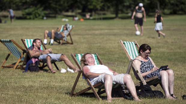 People enjoy the weather in Hyde Park