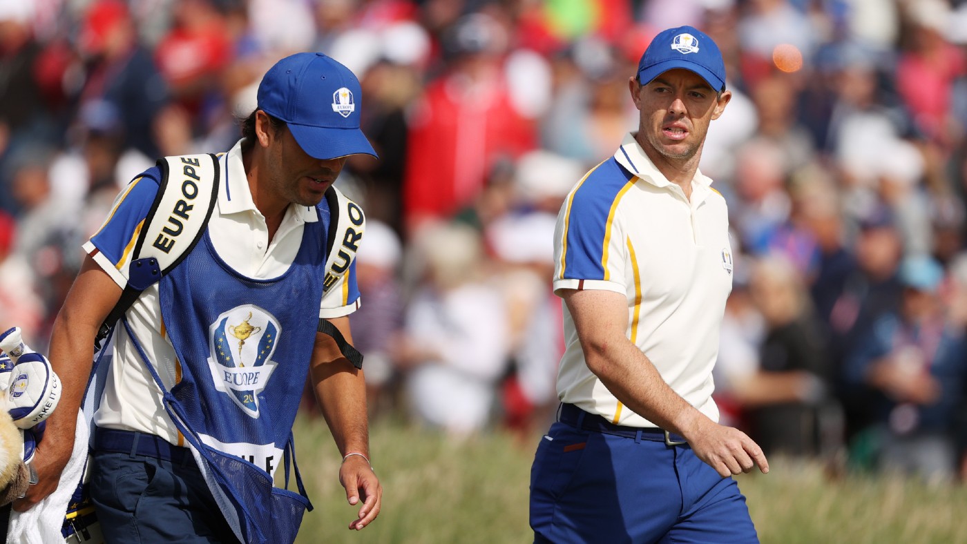 Rory McIlroy walks with his caddie during the 43rd Ryder Cup 
