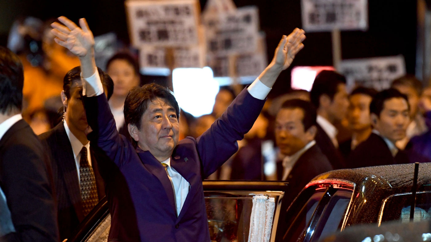Prime Minister Shinzo Abe celebrates his landslide victory