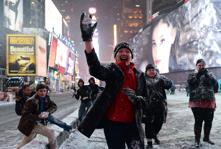 A group of youth from Texas play snow-ball-fighting on a deserted street in New York&#039;s Times Square during a snow storm on January 26, 2015. A major storm forced New York to impose driving ba