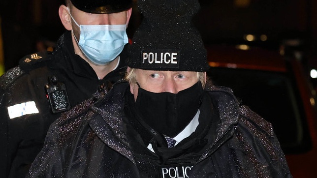 Boris Johnson attends a police raid