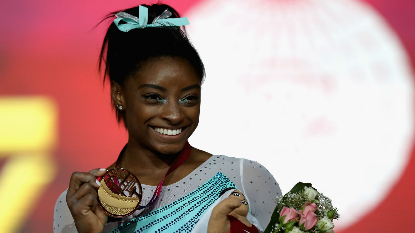 USA gymnast Simone Biles celebrates her gold in the women’s all-around final in Doha