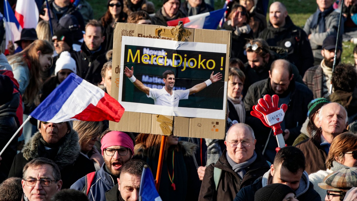 A ‘Thanks Djoko’ placard at a demonstration against health passes and Covid-19 vaccines in Paris on 15 January 
