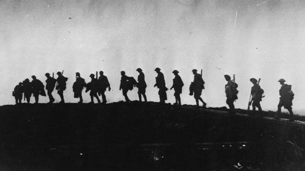 The silhouette of WWI troops as they march towards the front line
