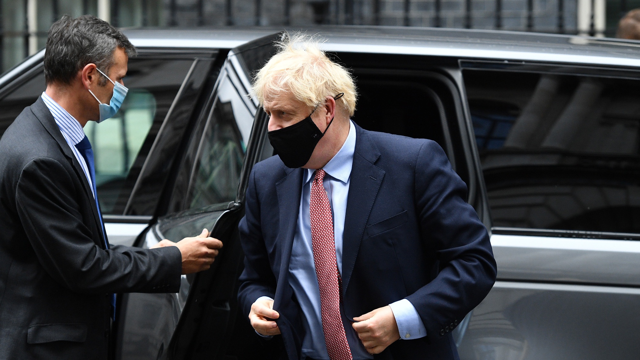 Boris Johnson leaves Downing Street to deliver his address to the virtual Conservative Party conference.