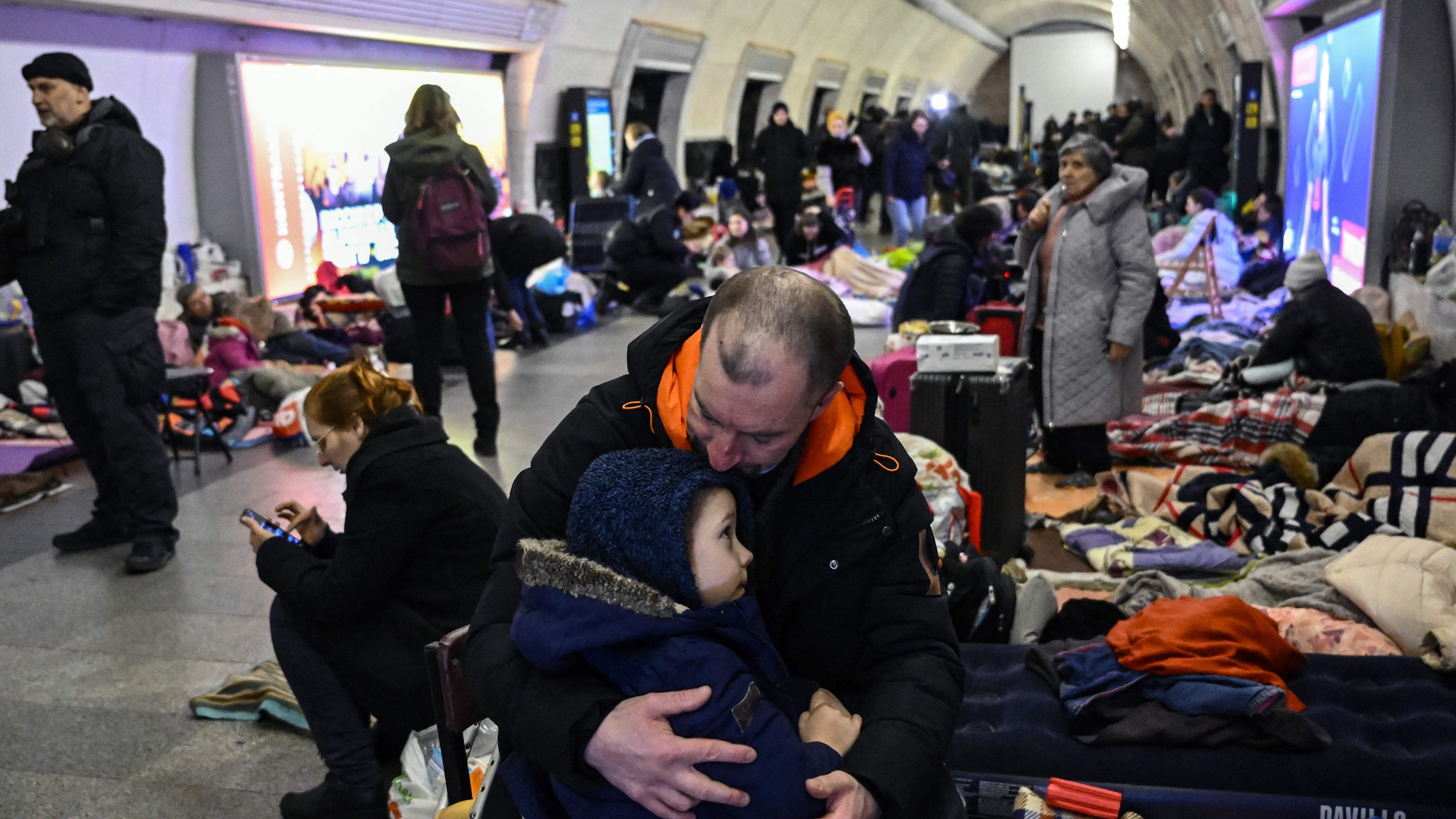 Families shelter in a Kyiv metro station during a Russian bombardment