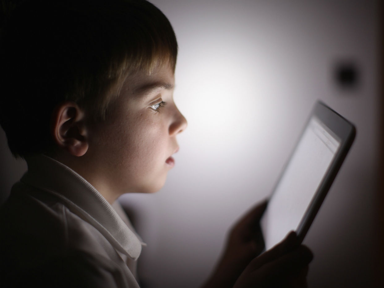 A child with a tablet