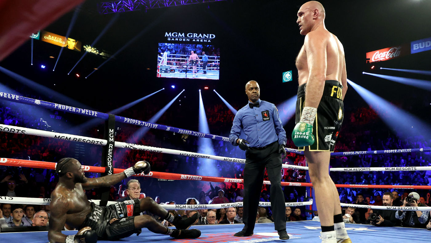 Tyson Fury knocked down Deontay Wilder in the third round of their WBC title rematch 