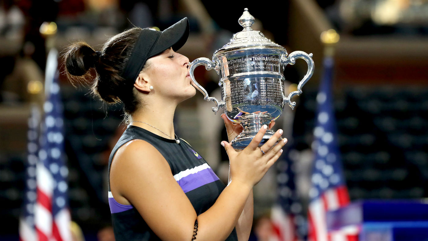 Bianca Andreescu kisses the championship trophy after her US Open win against Serena Williams