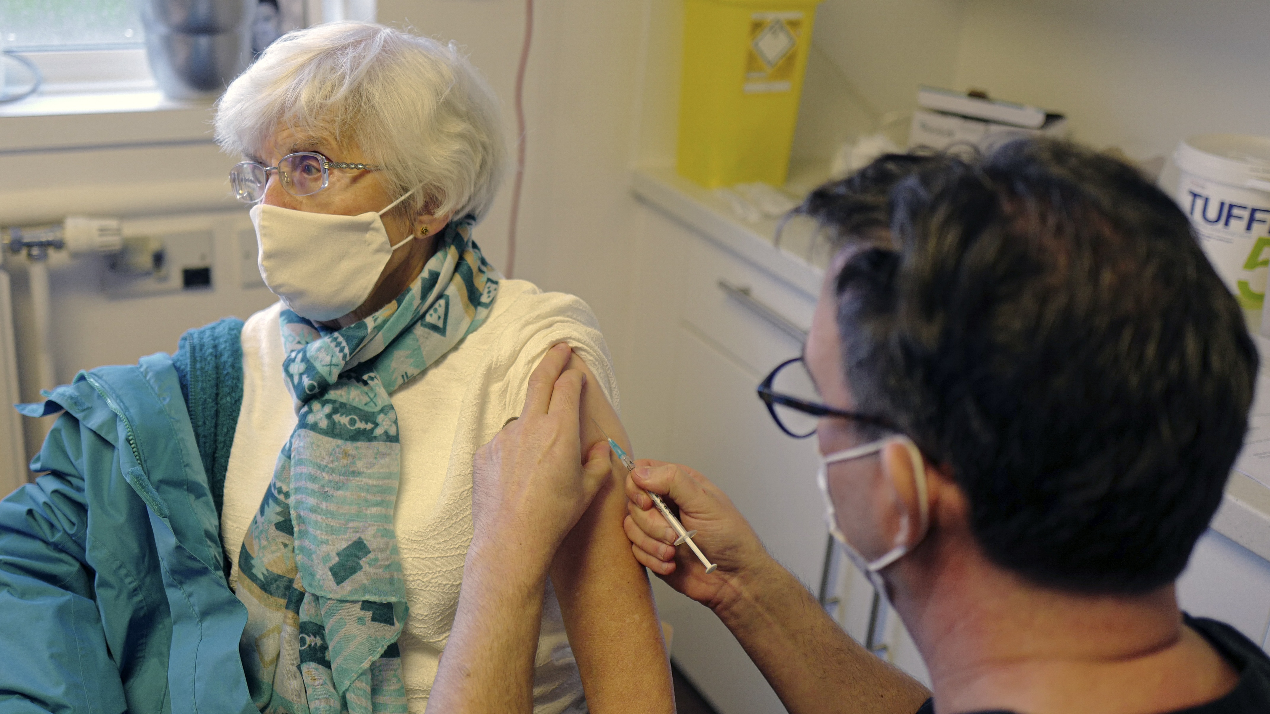 A GP administers the Covid-19 vaccine to a patient in Falmouth, Cornwall.