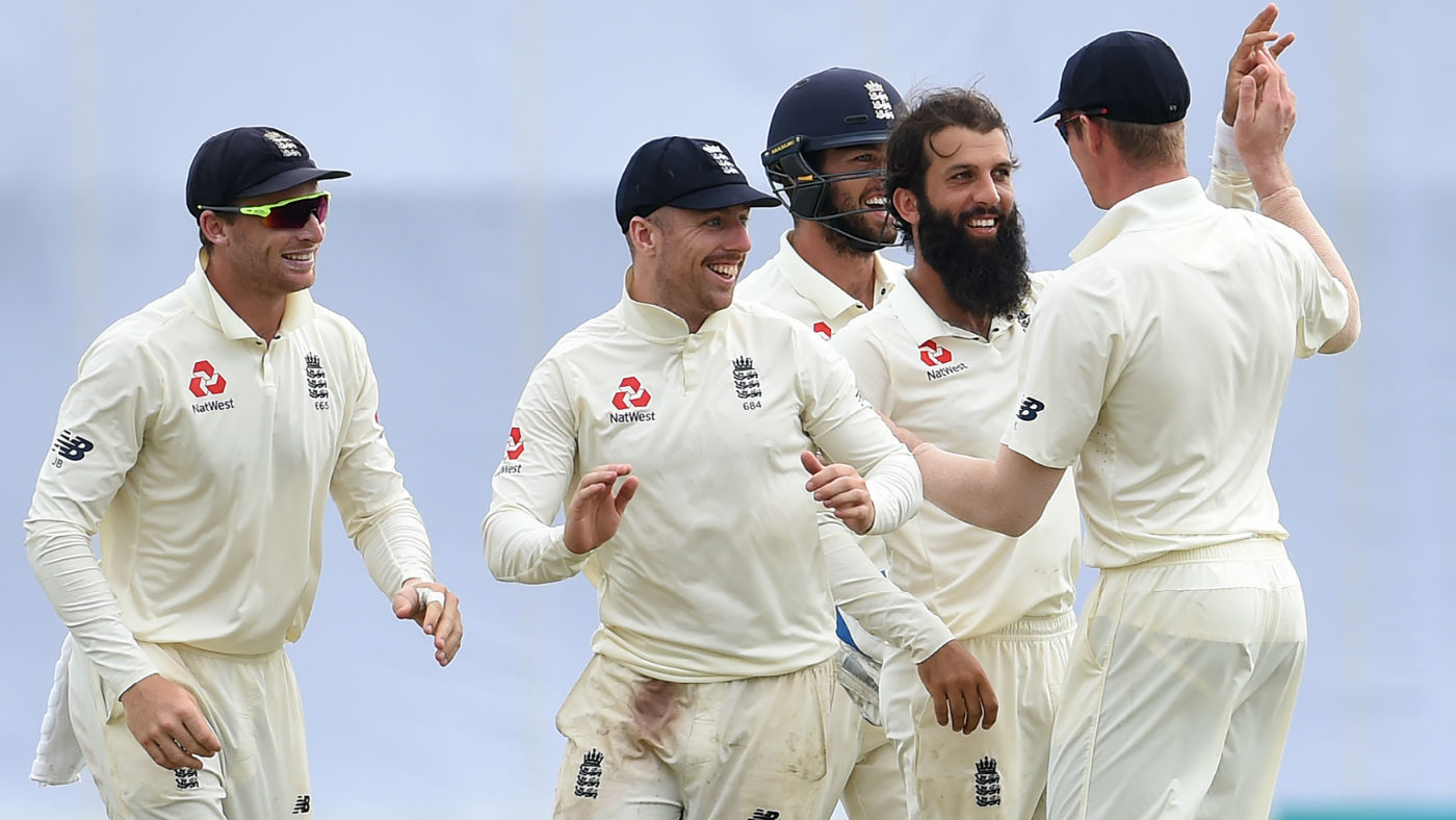 England players congratulate bowler Moeen Ali after he dismissed Niroshan Dickwella