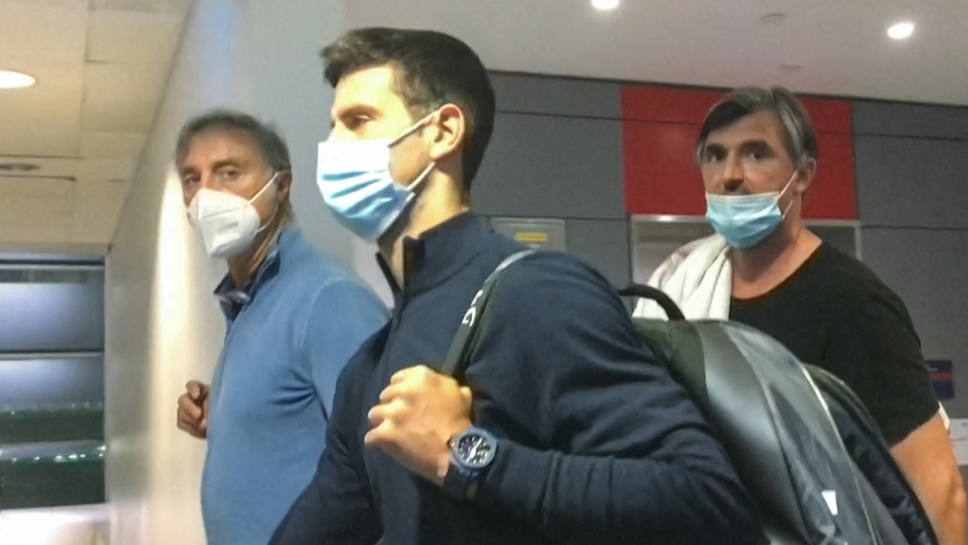 Novak Djokovic (centre) arrives in Dubai after leaving Australia 