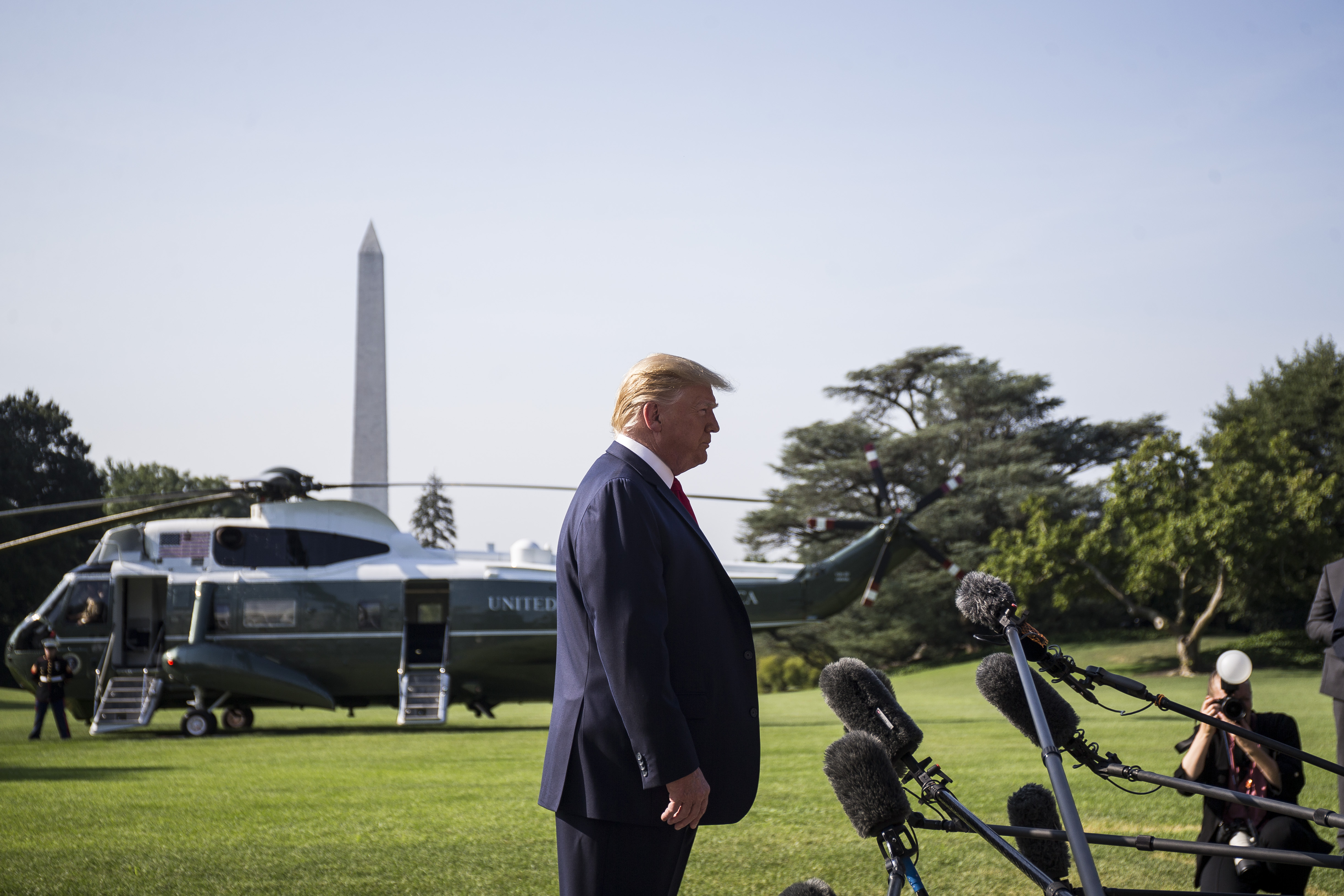 WASHINGTON, DC - AUGUST 07: President Donald Trump speaks to members of the press before departing from the White House en route to Dayton, Ohio and El Paso, Texas on August 7, 2019 in Washin