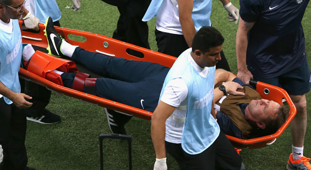England trainer Gary Lewin is stretchered off the field