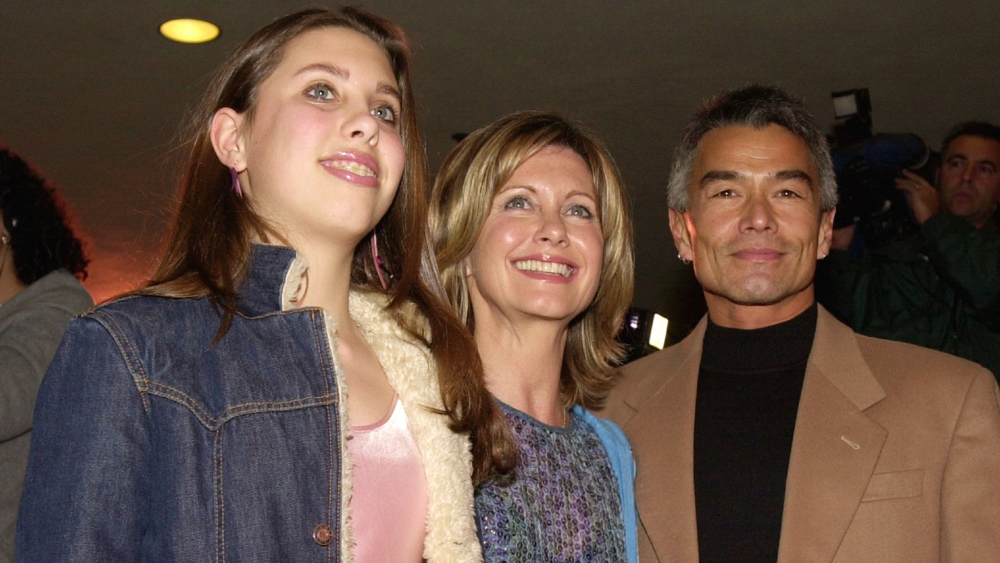 Newton-John with her daughter, Chloe, and boyfriend Patrick McDermott