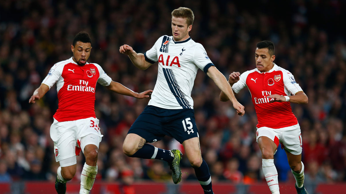 Eric Dier battles for the ball with Francis Coquelin and Alexis Sanchez