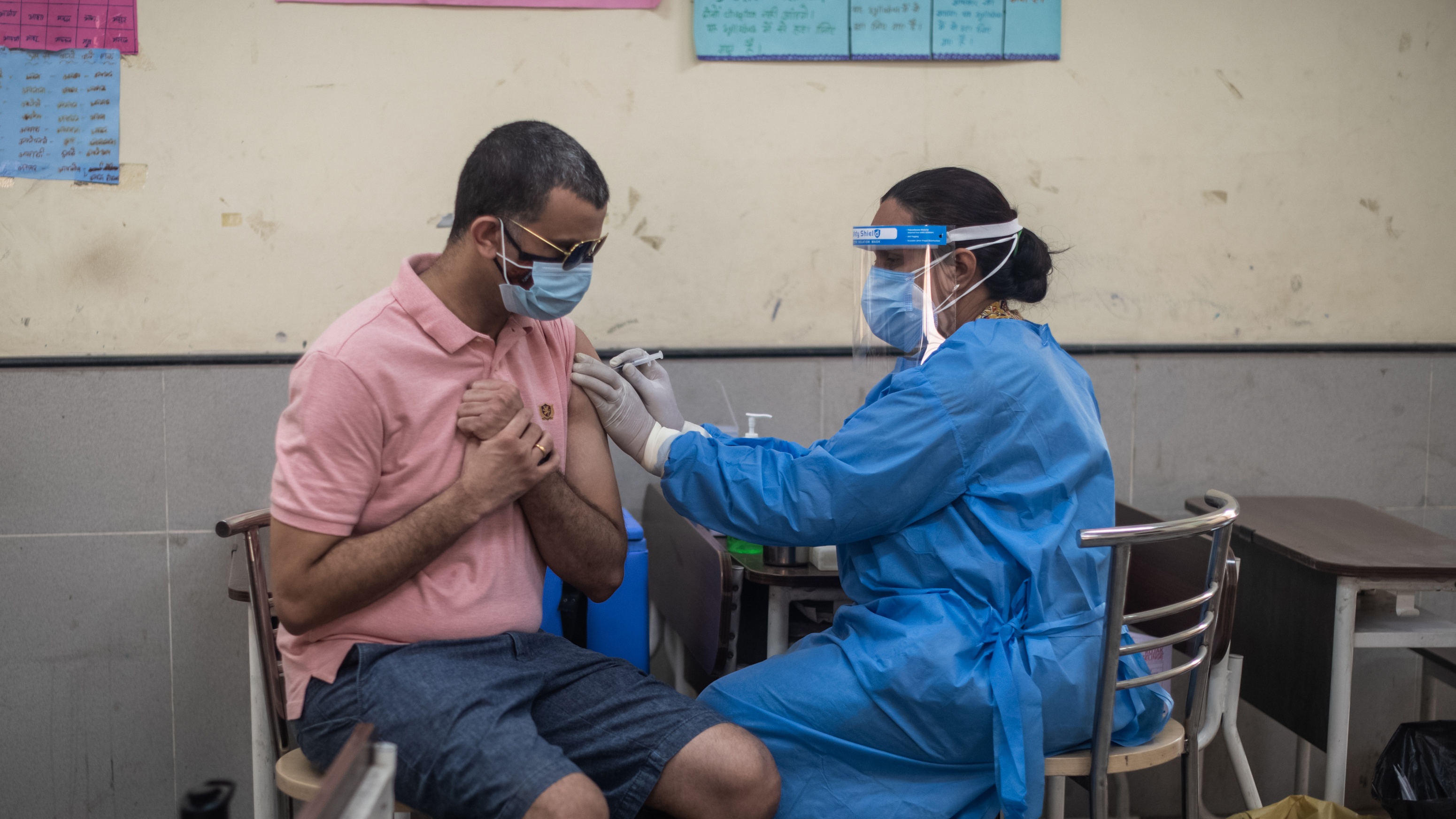 A man receives his Covid-19 vaccine in New Delhi, India