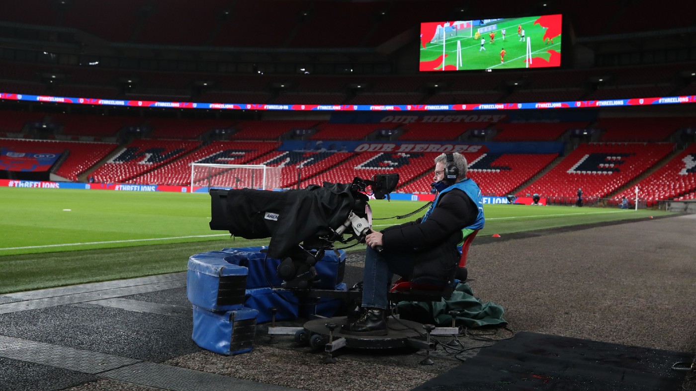 A TV cameraman at Wembley Stadium in London 