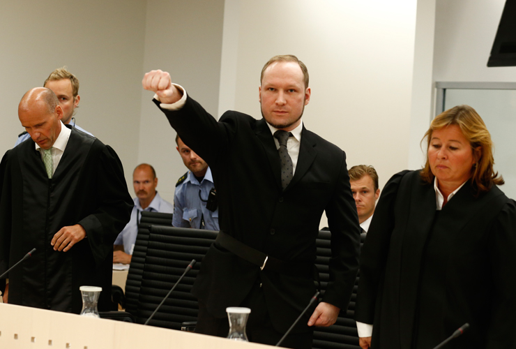Self-confessed mass murderer Anders Behring Breivik raises his fist in a right-wing salute 