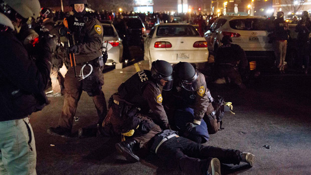 Police make an arrest during a protest in Ferguson