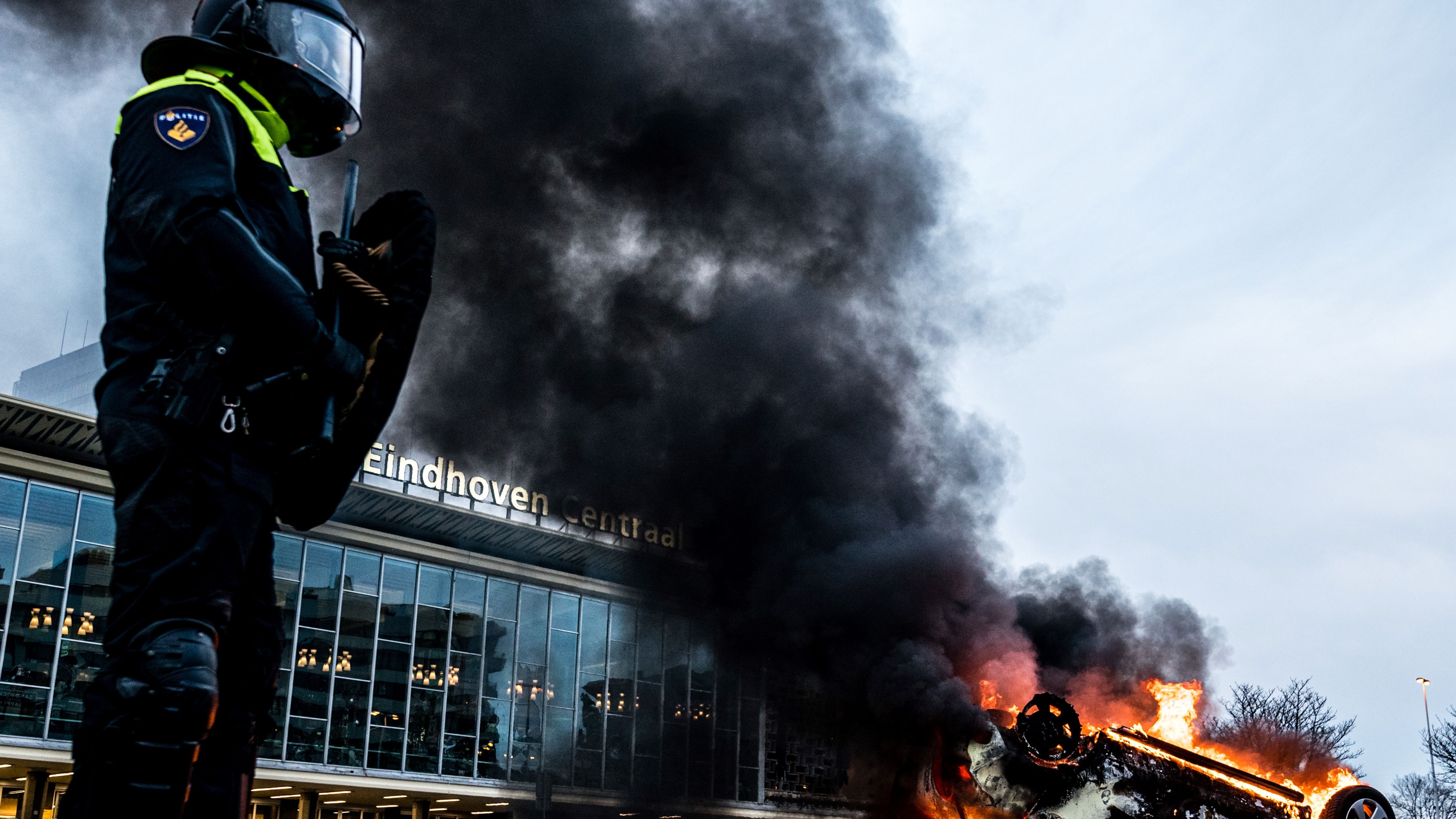 A car burns during anti-lockdown protests in Eindhoven in January