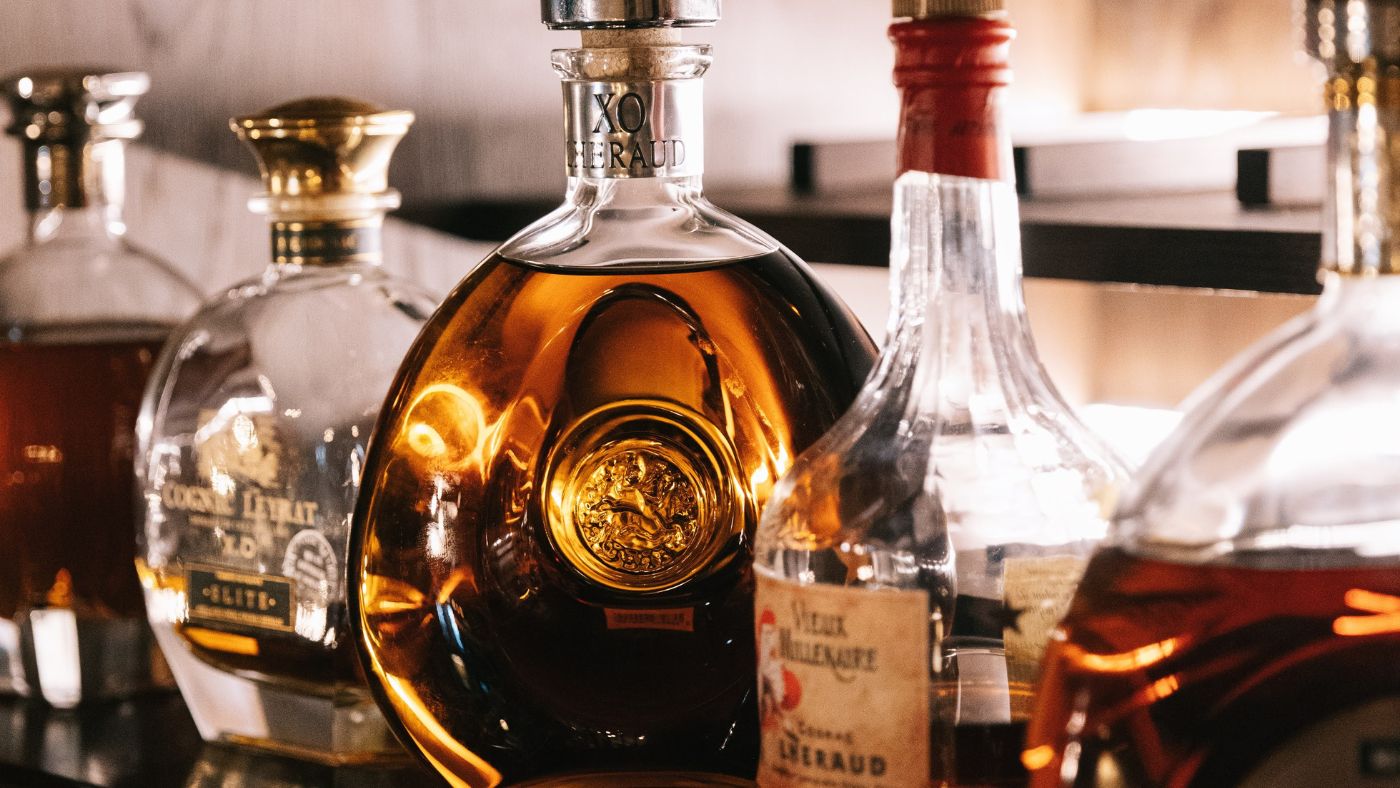 hotel Cognac bottles on display screen at the bar
