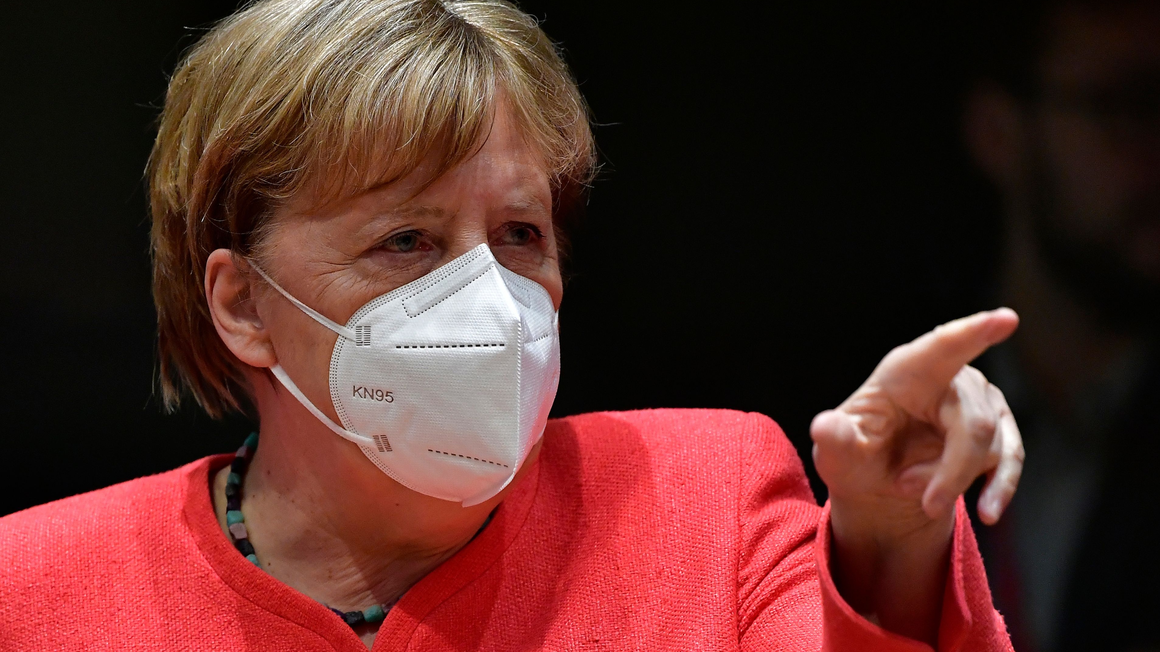 Angela Merkel pictured wearing a white face mask.