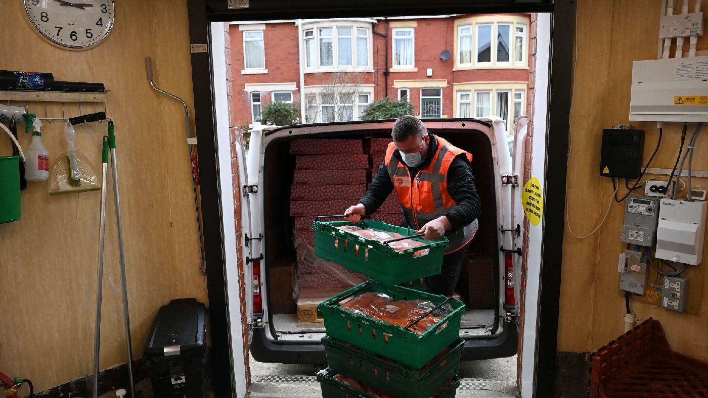 A volunteer is seen sorting food at Blackpool Food Bank